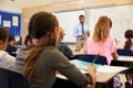 Kids listening to teacher at an elementary school class