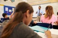 Kids listening to teacher during an elementary school lesson Royalty Free Stock Photo