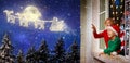 Kids look at Santa fly on Christmas eve Royalty Free Stock Photo