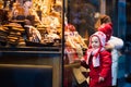 Kids looking at candy and pastry on Christmas market Royalty Free Stock Photo