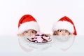 Kids lurking to get a glimpse of santa Royalty Free Stock Photo