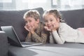 Preschooler kids lying on a sofa