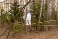 Kids-made homemade bird feeder in the park. Feeding trough from a plastic bottle