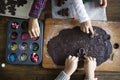 Kids making and decorating Christmas cookies