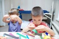 Kids making paper colored garland, siblings craft, brother and s Royalty Free Stock Photo