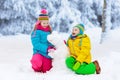 Kids making winter snowman. Children play in snow. Royalty Free Stock Photo