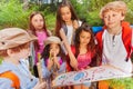 Kids with map on treasure hunt navigation activity Royalty Free Stock Photo