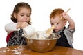 Kids measuring and mixing in kitchen