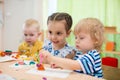 Kids doing arts and crafts in day care centre Royalty Free Stock Photo