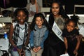 Kids models posing frontstage with miss United states during petiteParade