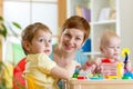 Kids and mother playing colorful clay toy at home Royalty Free Stock Photo