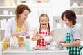 Kids and mother washing the dishes