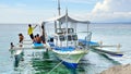 Kids near the fisherman's boat. Royalty Free Stock Photo