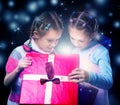 Kids open a magic present box Royalty Free Stock Photo