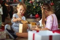 Kids opening gifts. children opening  Christmas gift at home Royalty Free Stock Photo