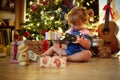 Kids opening gifts. girl opening  Christmas gift at home Royalty Free Stock Photo