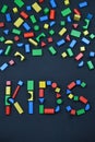 KIDS out of colorful wooden toy blocks on black Royalty Free Stock Photo