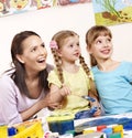 Kids painting in preschool.