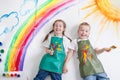 Kids painting rainbow