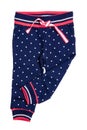 Kids pants isolated. A stylish fashionable dark blue denim trousers with white dots for the little girl. Children sport trousers