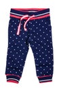 Kids pants isolated. A stylish fashionable dark blue denim trousers with white dots for the little girl. Children sport trousers