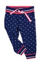 Kids pants isolated. A stylish fashionable dark blue denim trousers with white dots for the little girl. Children sport trousers