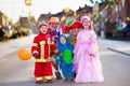 Kids and parents on Halloween trick or treat Royalty Free Stock Photo