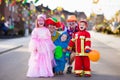 Kids and parents on Halloween trick or treat