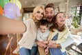 Kids and parents having a good time while taking a selfie at home together. Family, leisure, together Royalty Free Stock Photo