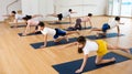 Kids and parents doing bird dog exercise in gym Royalty Free Stock Photo