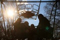 Kids with parents on a viewing car in an amusement park in the early spring