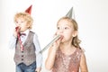 Kids with party blowers