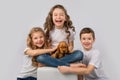 Kids pet friendship concept - children holding red puppy isolated on white background Royalty Free Stock Photo