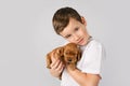 Kids pet friendship concept - little boy with red puppy isolated on white background Royalty Free Stock Photo