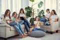 Kids with phones and tablets, with smartphones and headphones. Group of teenage girls is using gadgets. Royalty Free Stock Photo