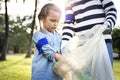 Kids picking up trash in the park