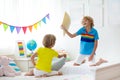 Kids pillow fight. Bedroom for two children Royalty Free Stock Photo