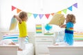 Kids pillow fight. Bedroom for two children Royalty Free Stock Photo