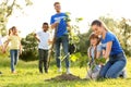 Kids planting trees with volunteers Royalty Free Stock Photo