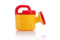 Kids plastic watering can isolated on white Royalty Free Stock Photo