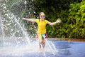 Kids at aqua park. Child in swimming pool. Royalty Free Stock Photo