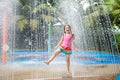 Kids play in aqua park. Children at water playground of tropical amusement park. Little girl at swimming pool. Child playing at Royalty Free Stock Photo