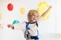 Kids play astronaut. Space and planet child game Royalty Free Stock Photo