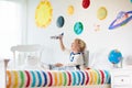 Kids play astronaut. Space and planet child game Royalty Free Stock Photo