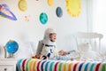 Kids play astronaut. Space and planet child game Royalty Free Stock Photo