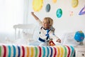 Kids play astronaut. Space and planet child game Royalty Free Stock Photo