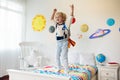 Kids play astronaut. Space and planet child game Royalty Free Stock Photo