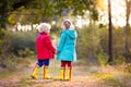 Kids play in autumn park. Children in fall. Royalty Free Stock Photo