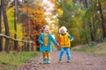 Kids play in autumn park. Children in fall Royalty Free Stock Photo