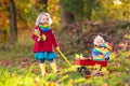 Kids play in autumn park. Children outdoor in fall Royalty Free Stock Photo